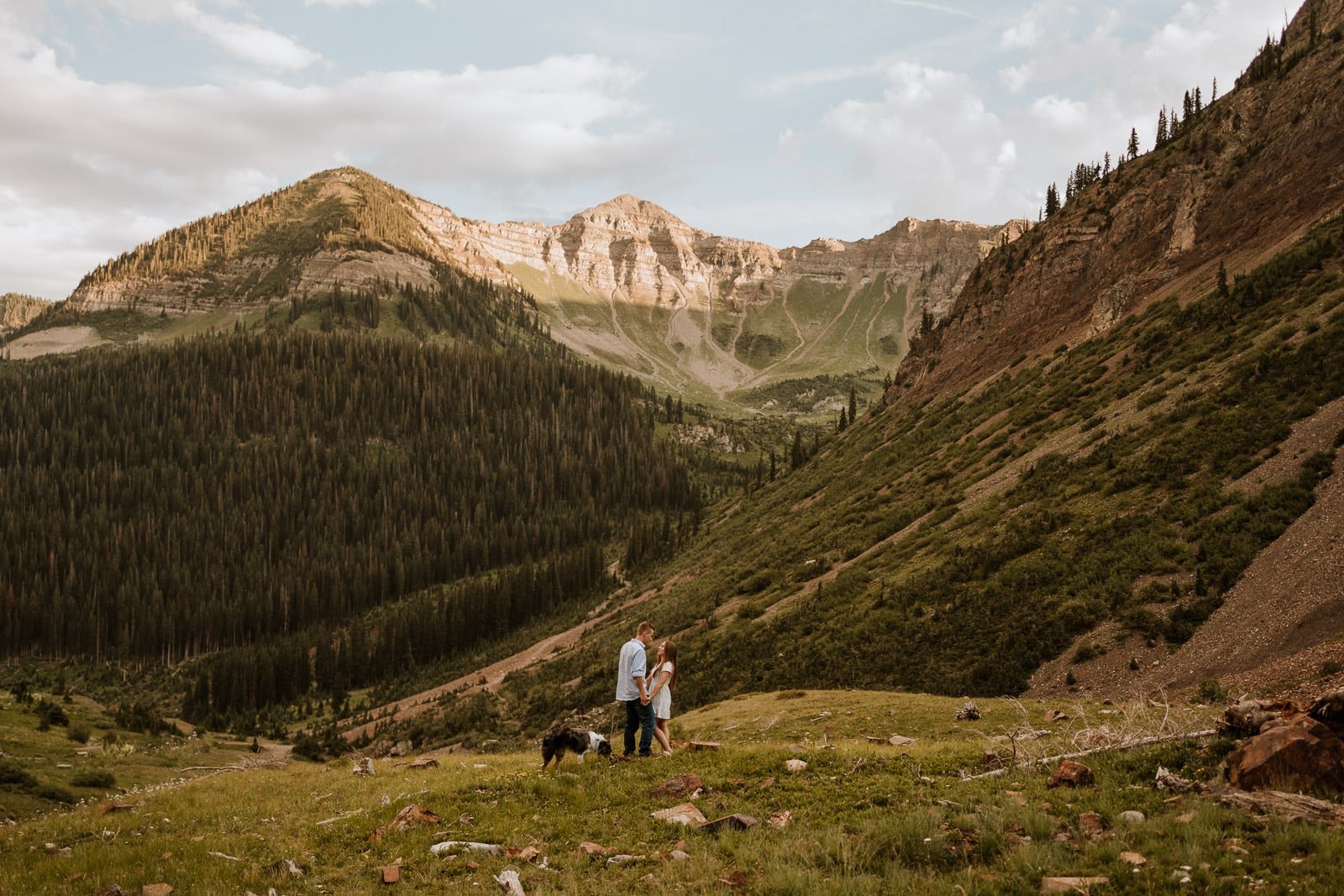 Paige & Skyler literally crossed rivers to get to this beautiful location in the Colorado mountains. After driving a Jeep up the road, we hiked the hill and they shared a kiss right at sunset with the Colorado mountains lit up behind them.