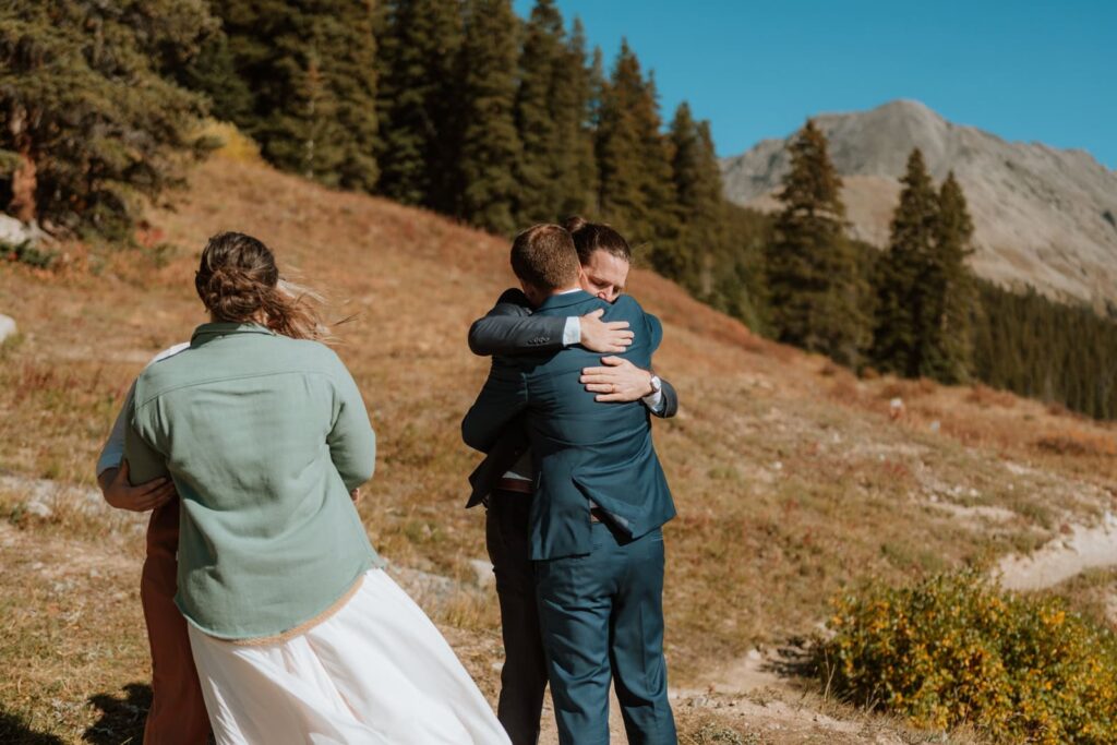 Emotional photo of the groom hugging his best man after the speech.