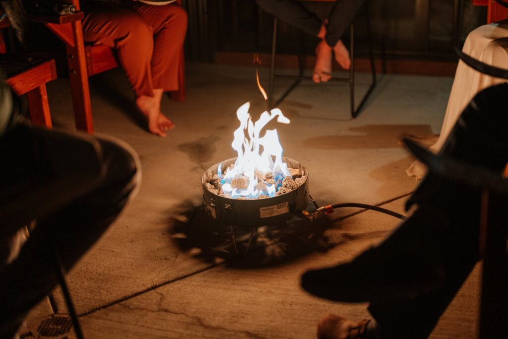 Detail photo that shows the flames roaring from a propane firepit.