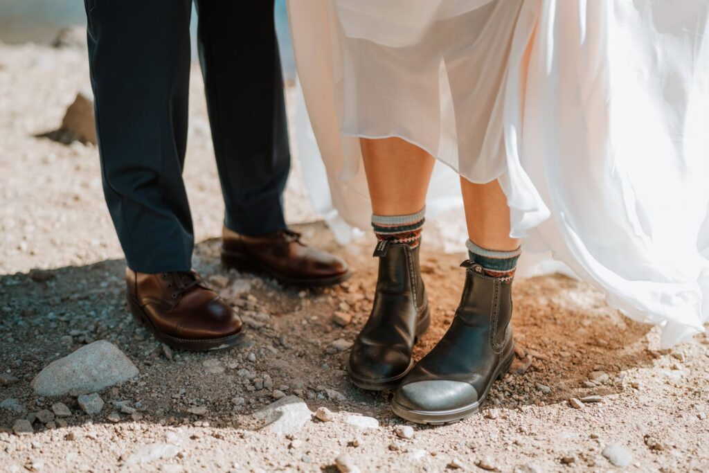 Fun photo to show the bride and grooms shoes for their small mountain wedding in Colorado. She has on blundstones while her future husband has dress shoes on.