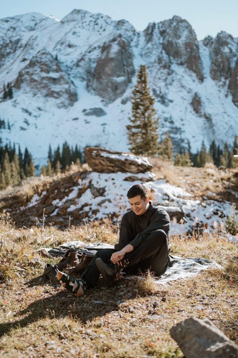 Getting ready for an off-road Telluride elopement by lacing up hiking boots