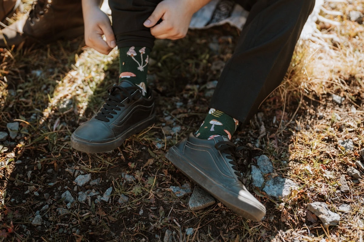 Fun mushroom-print socks for a groom during a 4x4 San Juan elopement in Colorado.